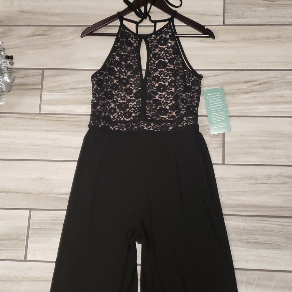 Jumpsuit by: R & M Collection.